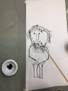 Ian Drawing with Sticks